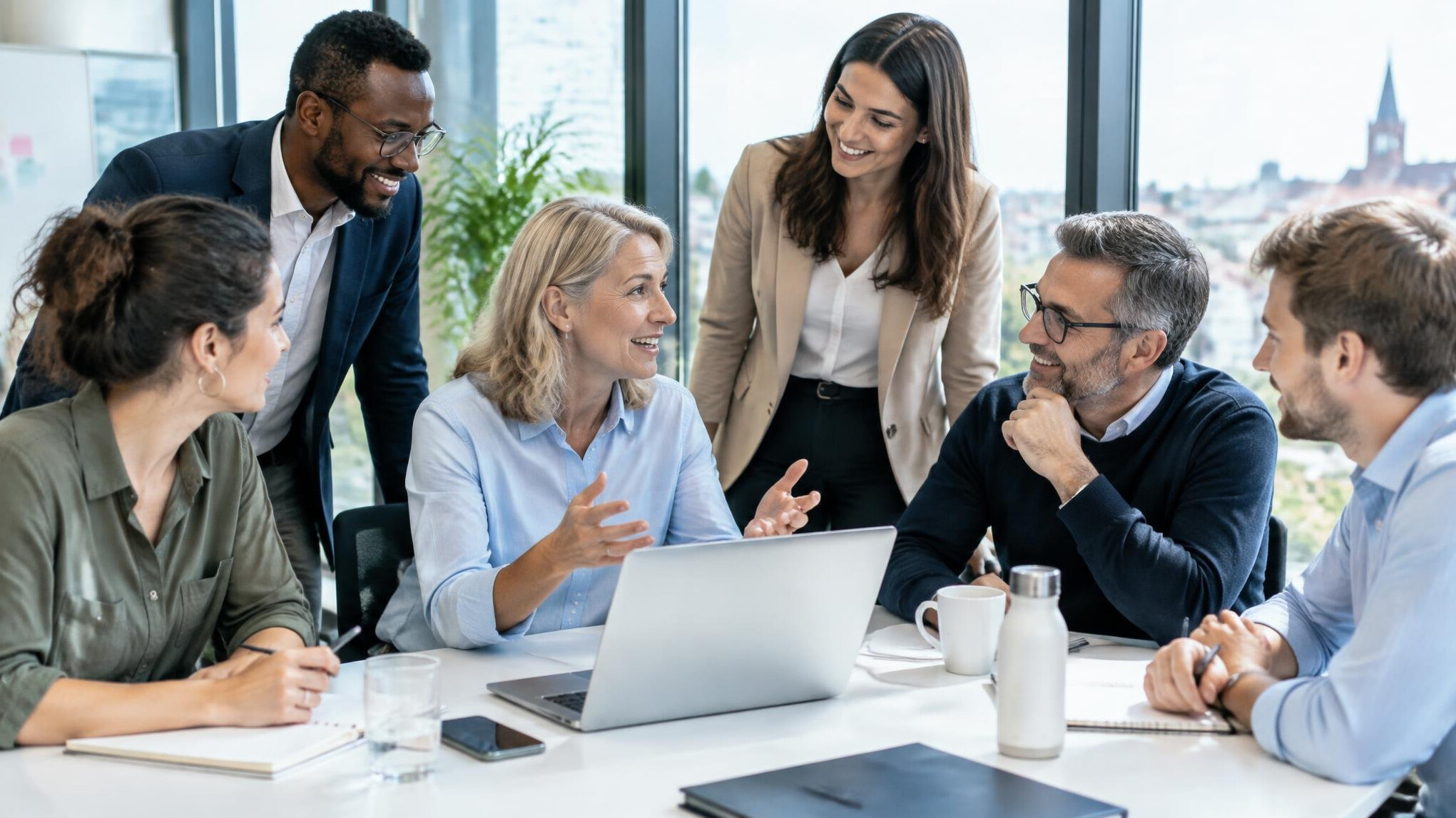 Diverse team gathered around a table in discussion