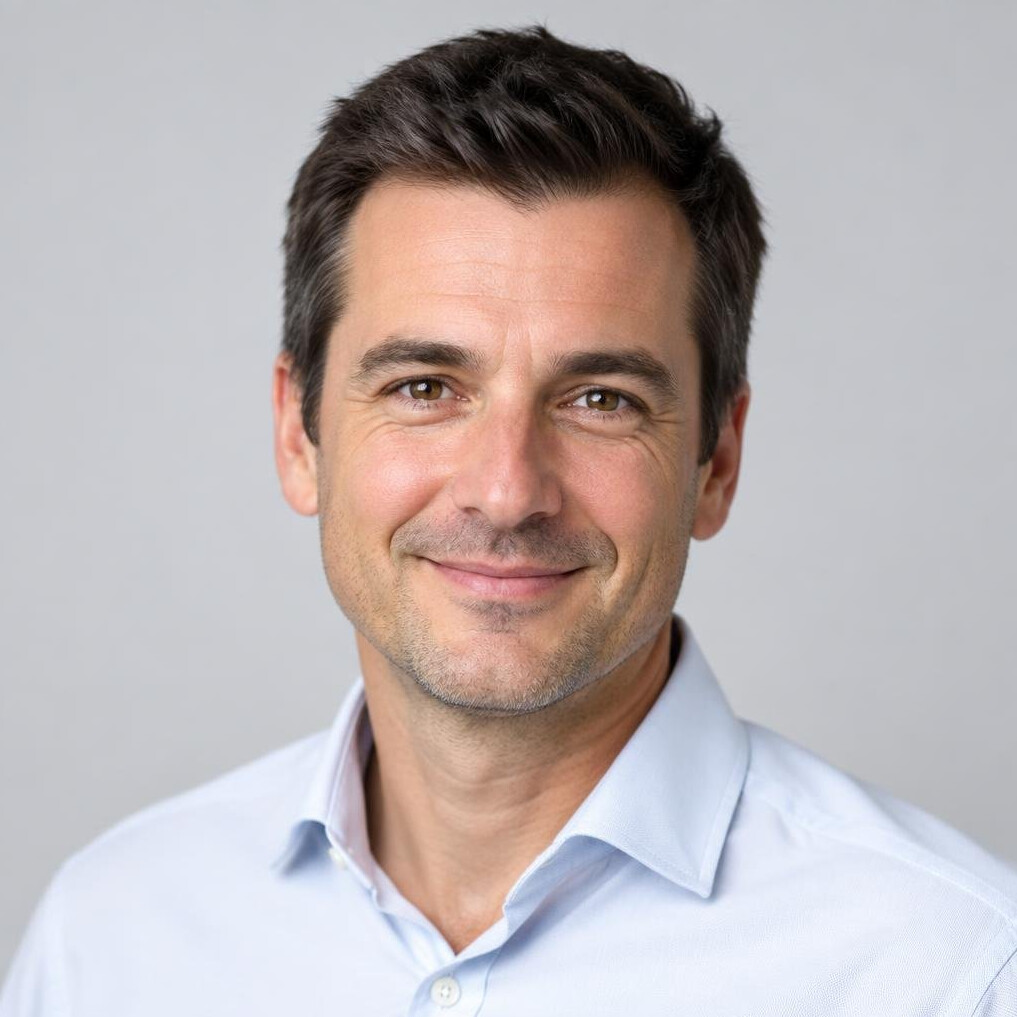 Studio portrait of a smiling man in a shirt